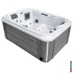Cocoa Point hot tub with grey side cabinet panels and white acrylic shell