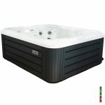 Clearwater Holiday hot tub side view showing grey cabinet panels and white acrylic shell