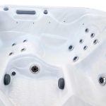 Laguna Deluxe hot tub lounger side view with jets and ergonomic seating